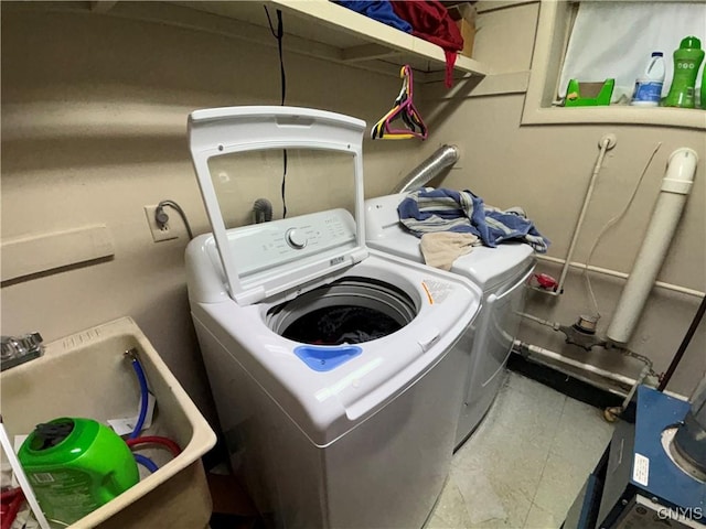 laundry area featuring laundry area and washing machine and dryer