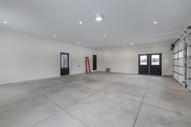 empty room with concrete flooring and recessed lighting