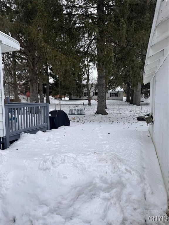 view of yard layered in snow