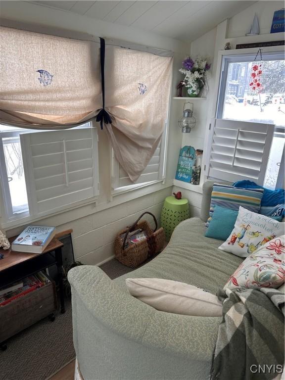 interior space with a sunroom and vaulted ceiling