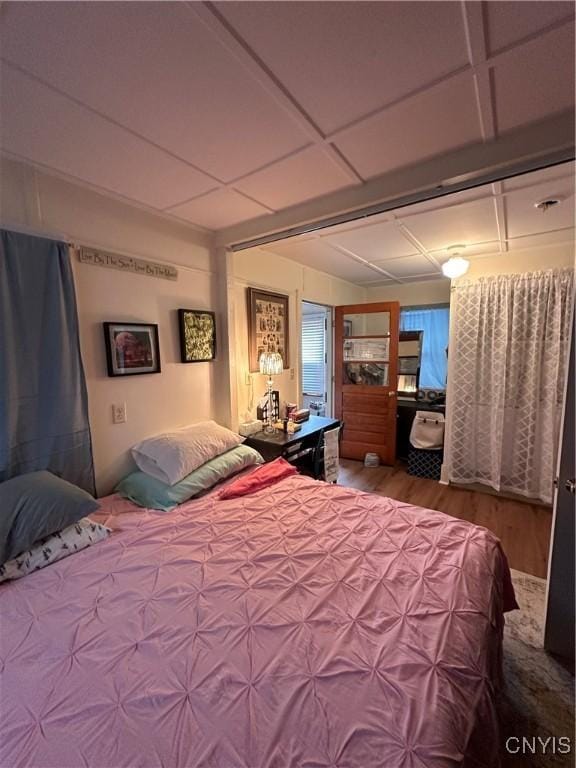 bedroom featuring wood finished floors