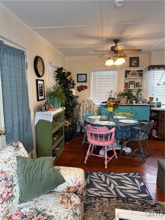 dining room with a ceiling fan and wood finished floors