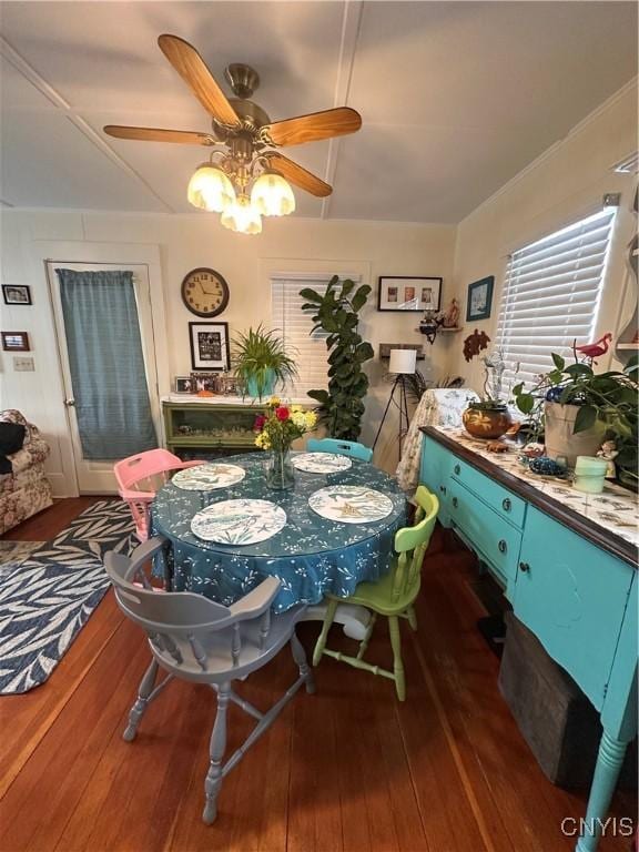 dining room with wood-type flooring and a ceiling fan