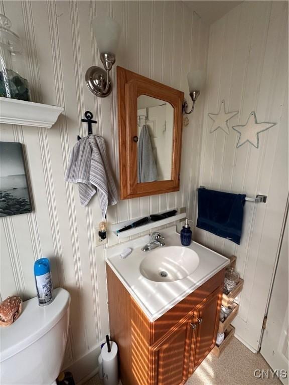 bathroom with toilet and vanity