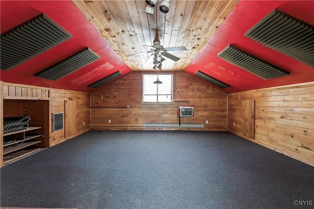 bonus room with a ceiling fan, wood ceiling, vaulted ceiling, carpet floors, and wood walls