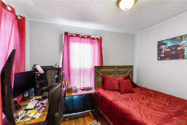 bedroom featuring wood finished floors