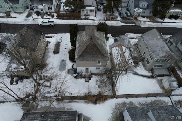 snowy aerial view with a residential view