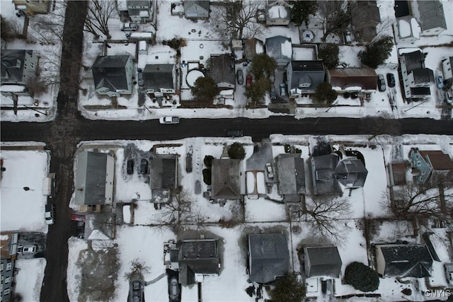 snowy aerial view featuring a residential view