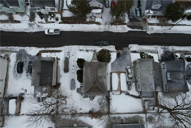 snowy aerial view featuring a residential view