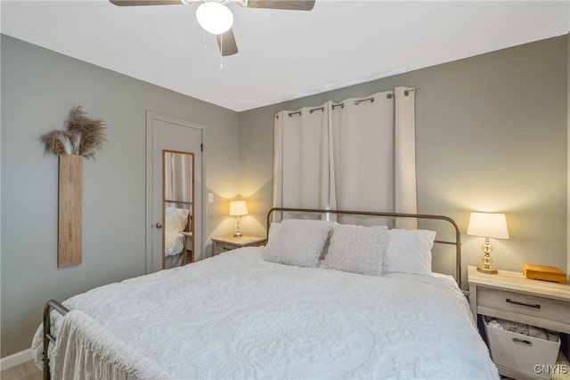 bedroom featuring ceiling fan and baseboards