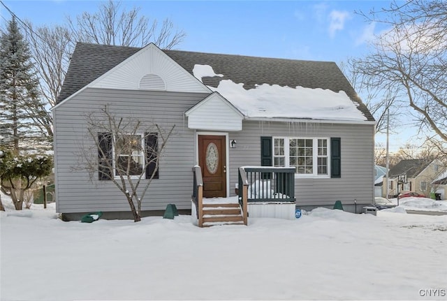 view of front of property with roof with shingles