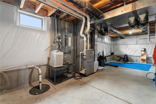 basement with electric panel and heating unit