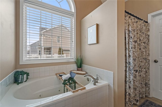 full bathroom with a shower with curtain, plenty of natural light, and a tub with jets