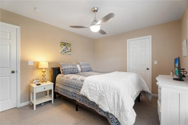 bedroom featuring a ceiling fan, light carpet, and baseboards