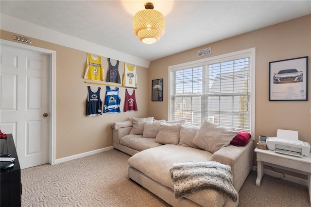 interior space featuring light colored carpet and baseboards