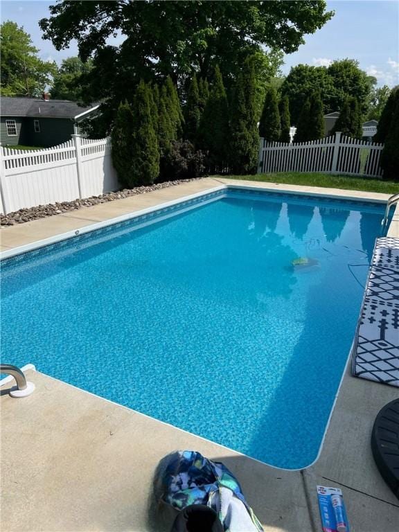 view of swimming pool featuring fence and a fenced in pool