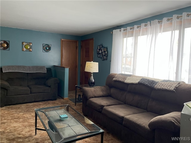 carpeted living room featuring a healthy amount of sunlight