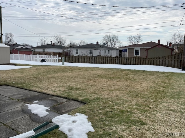 view of yard with a fenced front yard and a residential view