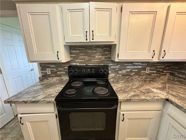 kitchen with white cabinetry, black / electric stove, and decorative backsplash