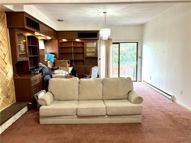 living room with carpet, visible vents, baseboard heating, and an inviting chandelier