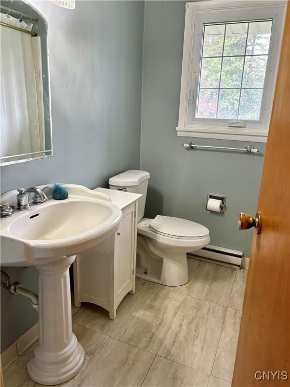 full bathroom featuring a baseboard radiator, curtained shower, and toilet