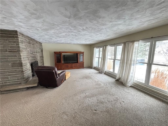 unfurnished living room with carpet, a textured ceiling, and a fireplace