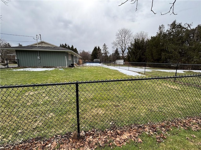 view of yard with a tennis court and fence