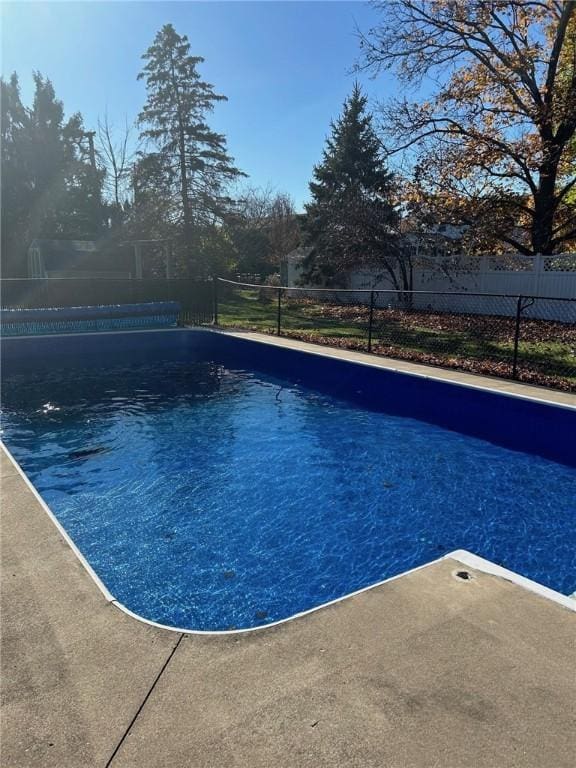 view of swimming pool featuring fence and a fenced in pool