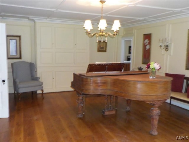 playroom featuring a chandelier and wood finished floors