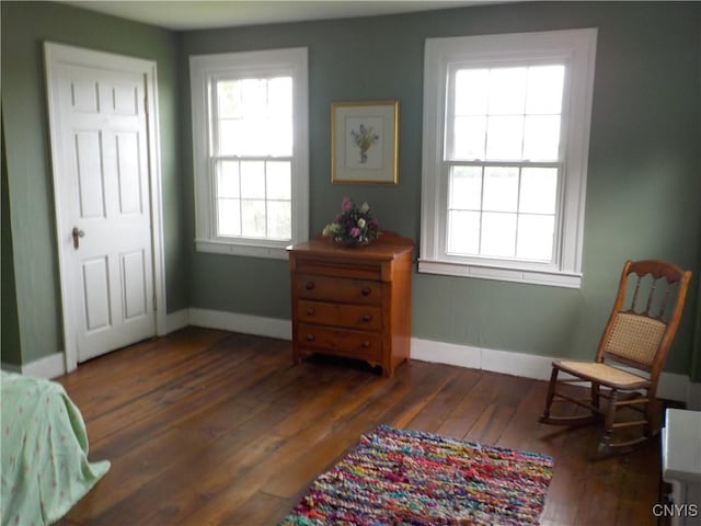 sitting room featuring hardwood / wood-style flooring and baseboards