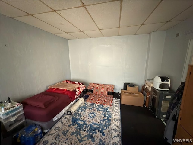 bedroom featuring a paneled ceiling