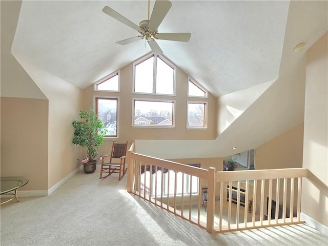 bonus room featuring high vaulted ceiling, carpet, and baseboards