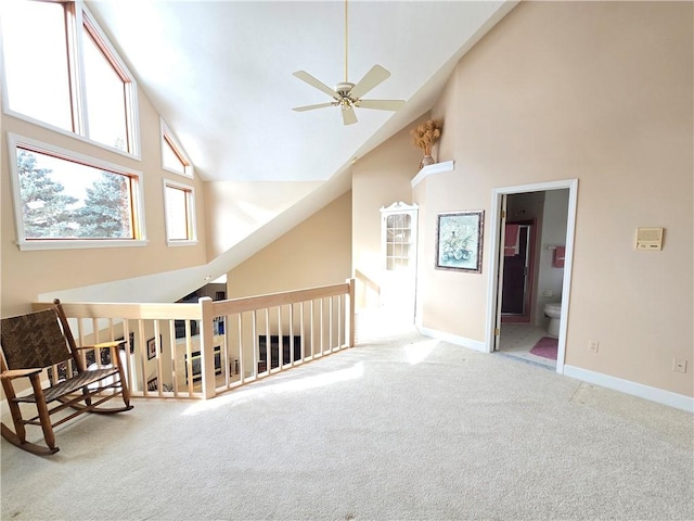 bonus room with ceiling fan, high vaulted ceiling, carpet flooring, and baseboards