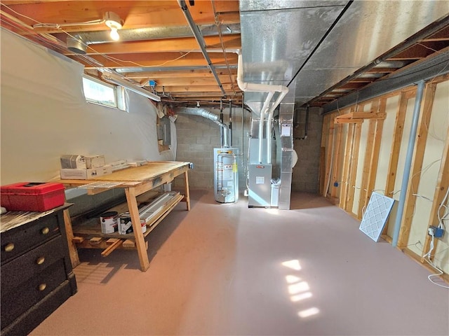 basement featuring gas water heater, electric panel, and heating unit