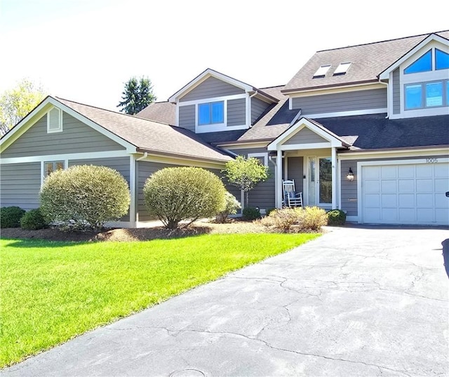 1005 Hillsboro Cove Cir, Webster, NY 14580 - view of front of house featuring an attached garage, a shingled roof, driveway, and a front yard