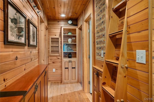 23000 County Route 57, Lyme, NY 13693 - hall with wooden walls, light wood-type flooring, wooden ceiling, and recessed lighting