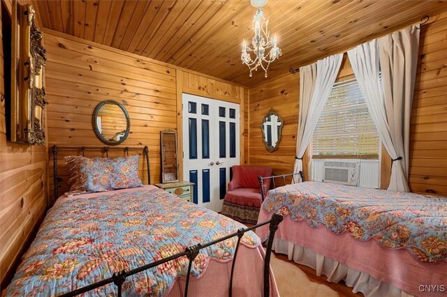23000 County Route 57, Lyme, NY 13693 - bedroom featuring a chandelier, wooden ceiling, cooling unit, and wood walls