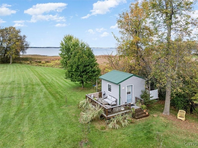 23000 County Route 57, Lyme, NY 13693 - view of grassy yard featuring a deck with water view