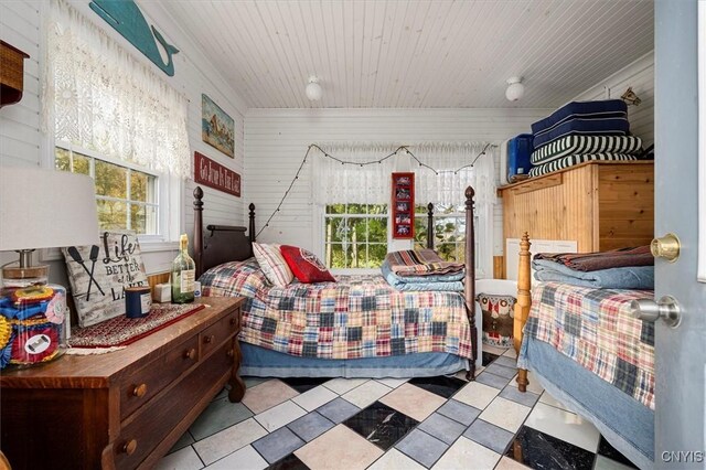 23000 County Route 57, Lyme, NY 13693 - bedroom with wood ceiling and wooden walls