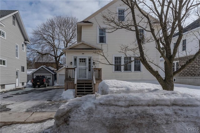 view of front of home featuring an outbuilding and a garage