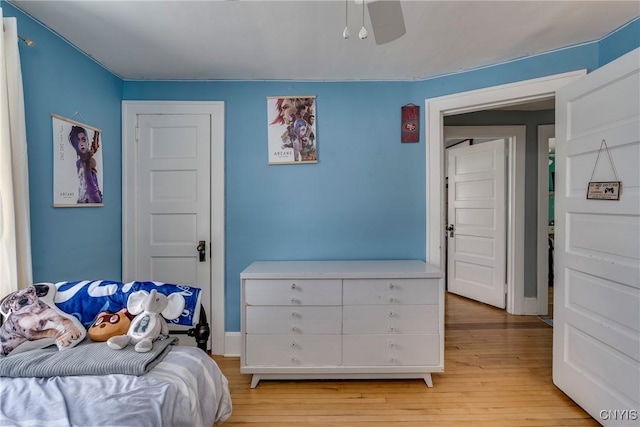 bedroom featuring light wood-style flooring and a ceiling fan