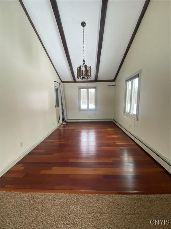 interior space with baseboards, lofted ceiling with beams, an inviting chandelier, and wood finished floors