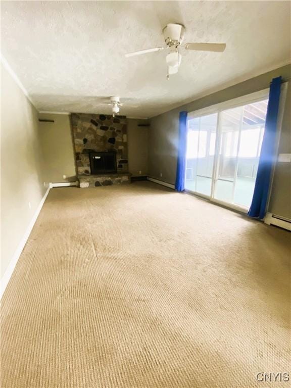 unfurnished living room with carpet floors, a fireplace, a textured ceiling, and ceiling fan