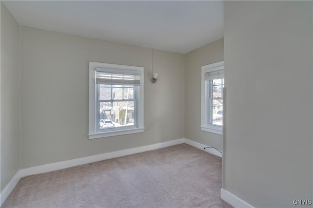 empty room with carpet flooring and baseboards