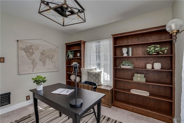 office space with light carpet and baseboards