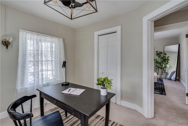 home office featuring light colored carpet and baseboards