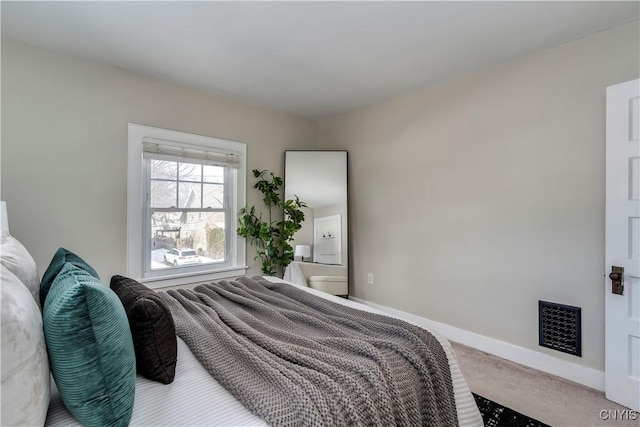 bedroom featuring carpet, visible vents, and baseboards