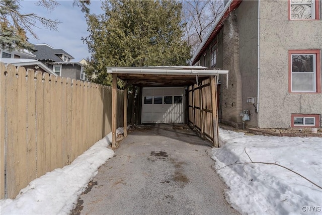 exterior space featuring a garage and fence