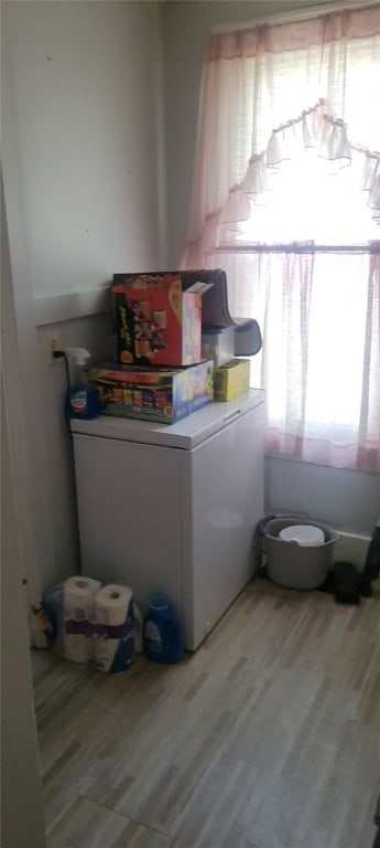 washroom with light wood finished floors