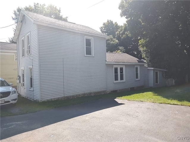 view of property exterior featuring a yard